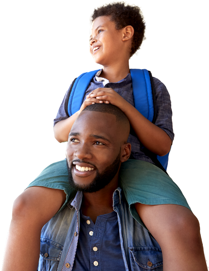 An image of a father with his young son on his shoulders smiling as they walk together